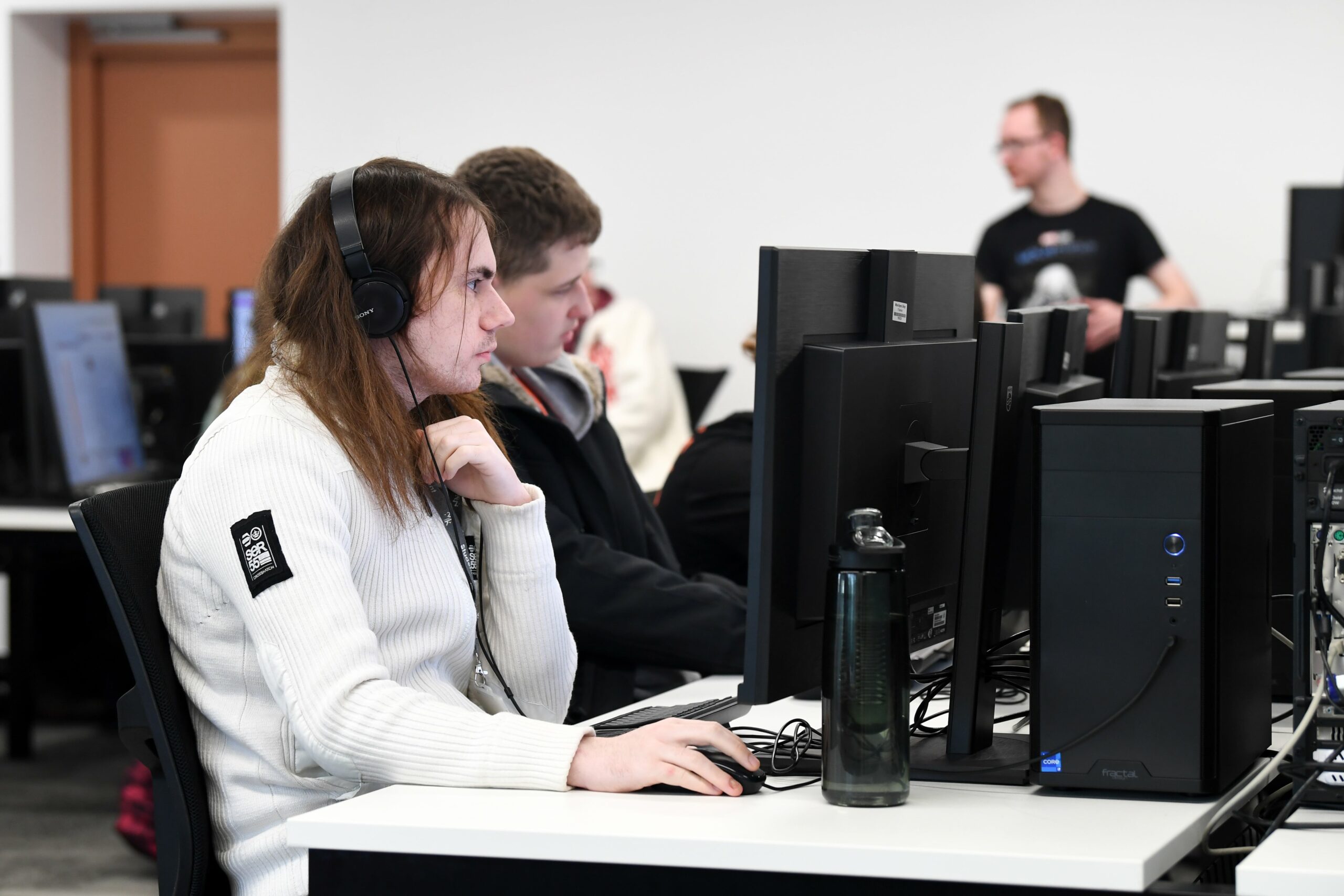 Computing classroom full of students learning