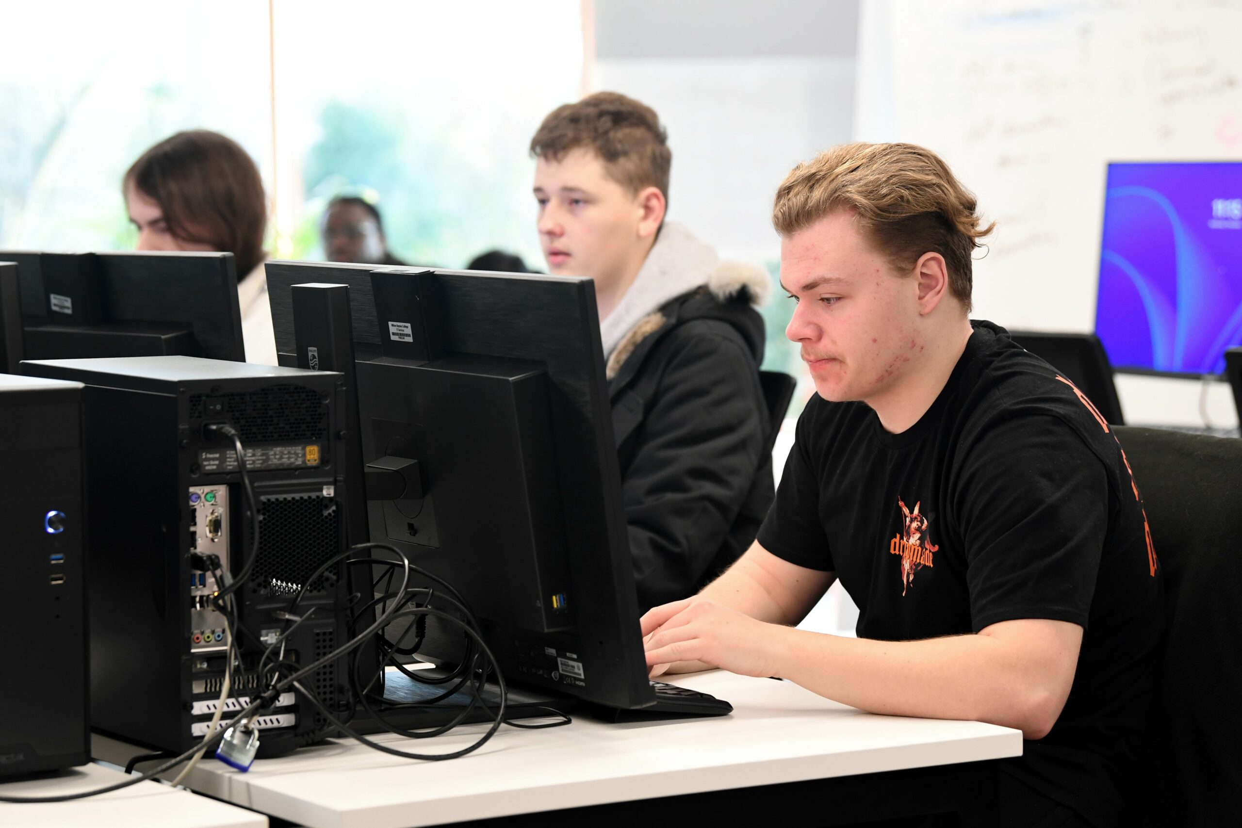 Students working in a computer room on desktops